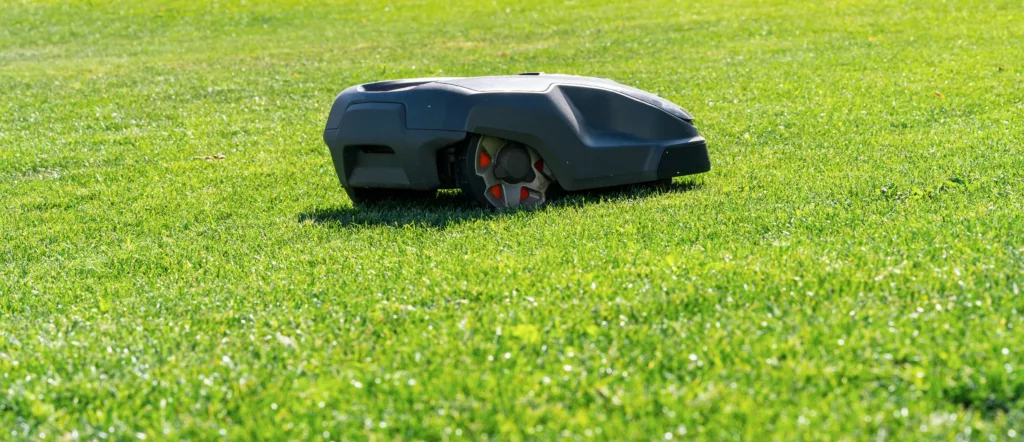 Robotic Lawn Mower On Grass Copyspace For Your Individual Text